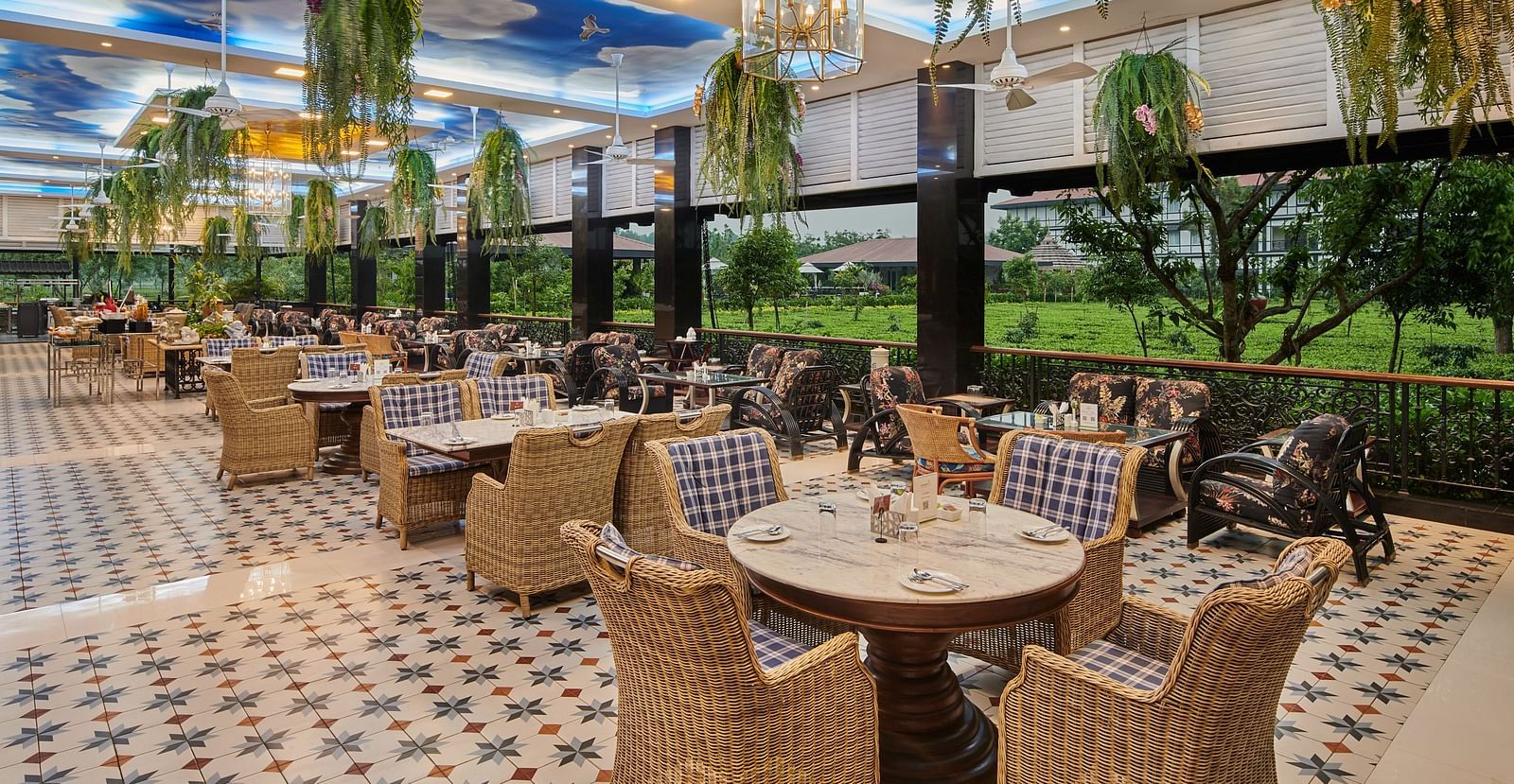 indoor seating space at tea pot - Mayfair Tea Resort, Siliguri 1