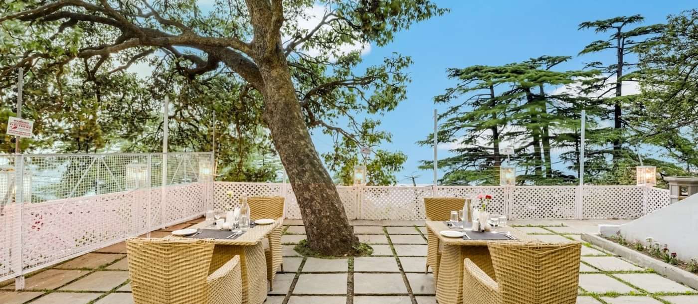 Outdoor dining area at Summit Le Royale Hotel
