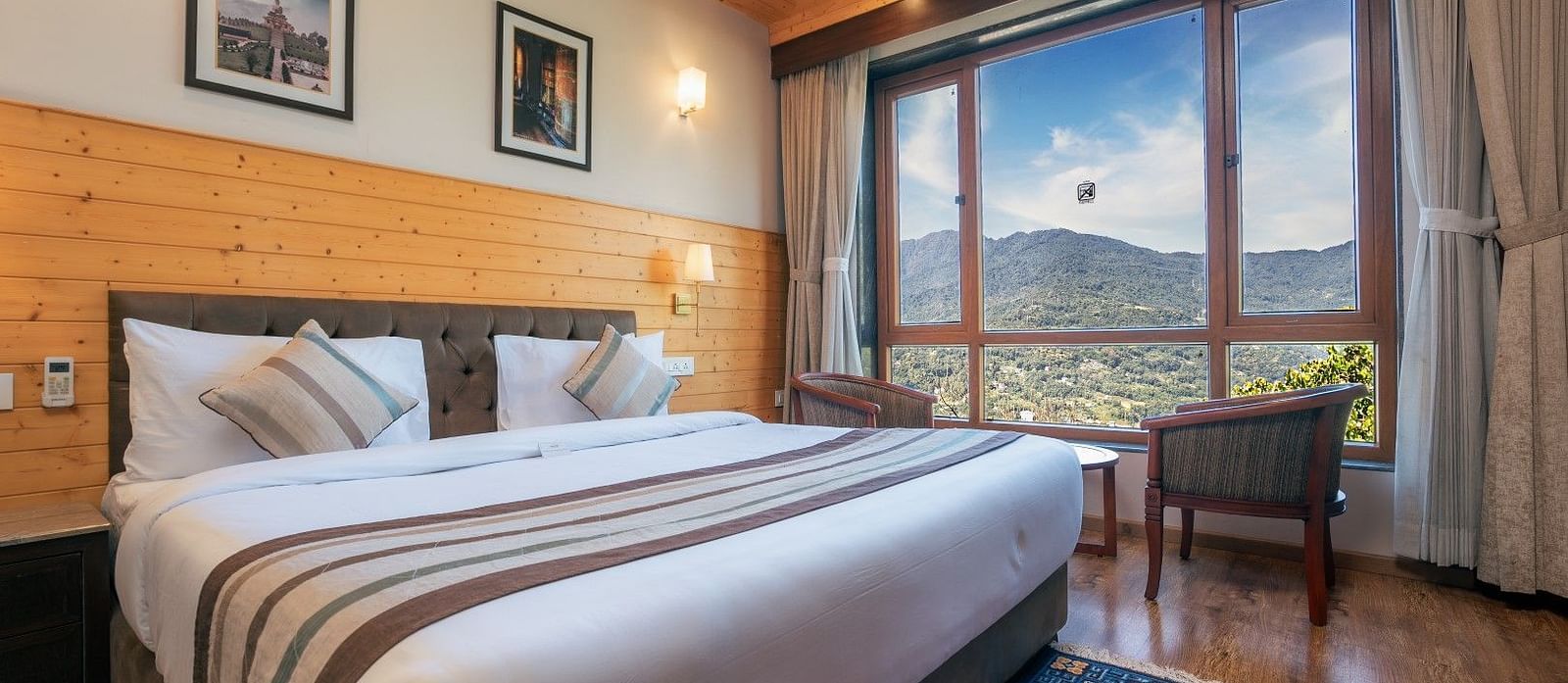 A room at Summit Alpine Abode with a double bed and mountain views