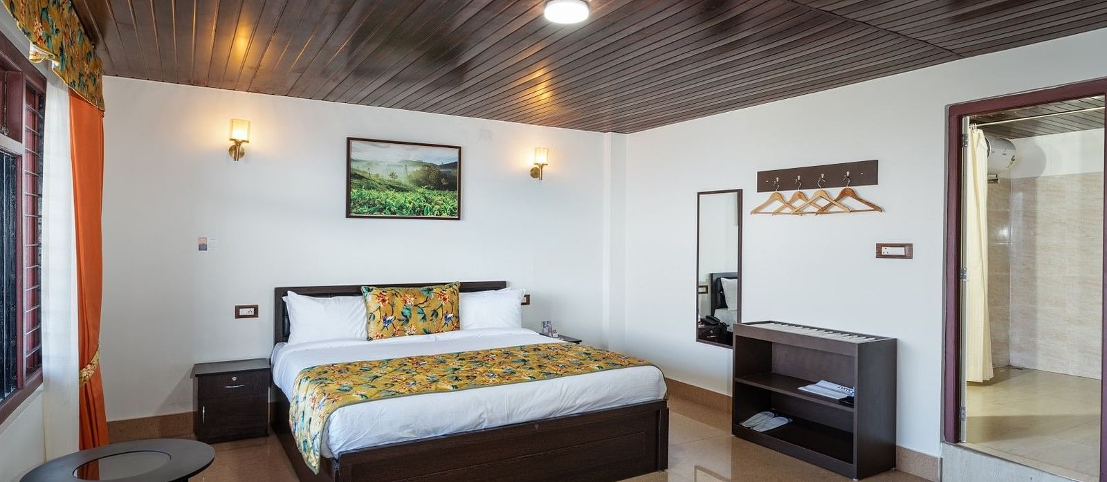 Image of a room with bed and wooden celing and flooring at Summit Sherpa Mountain Hotel & Spa, Kalimpong