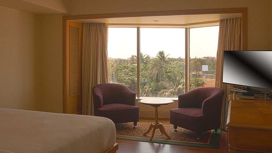 seating area in a Premium Partial Sea View Room at ramada plaza 1