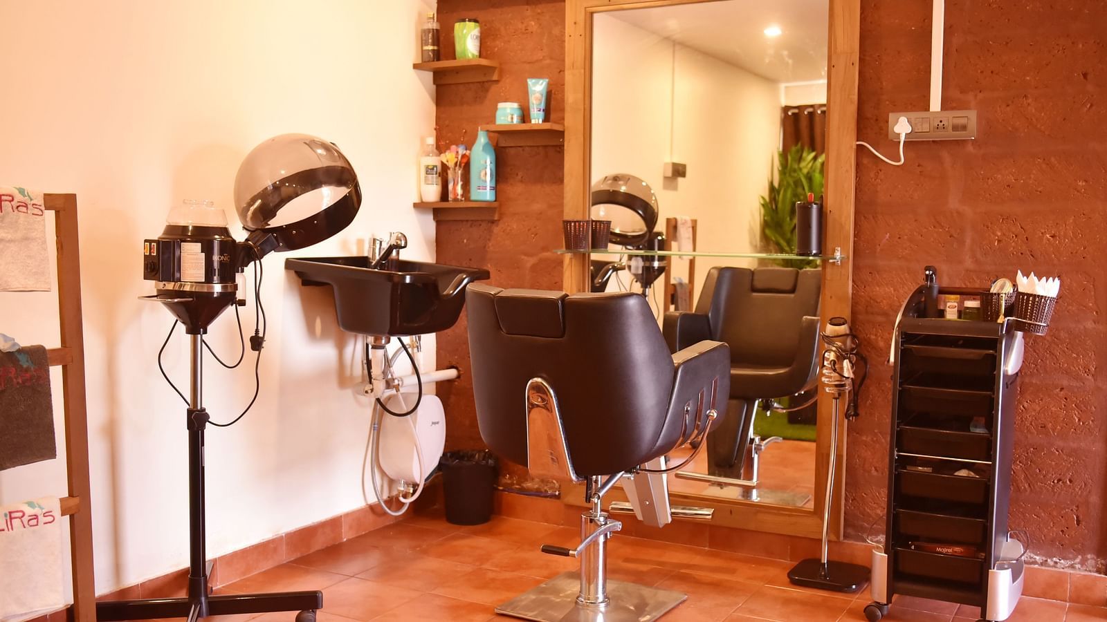 This image shows a hair salon area at Forest Escape, with styling chairs, mirrors, and professional equipment.