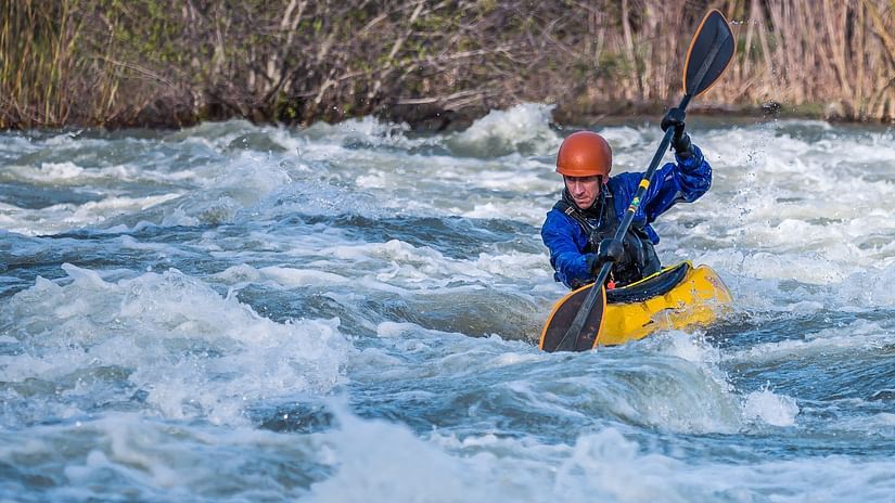 A person kayaking in lake