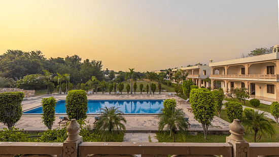 A view of the swimming pool and resort grounds at Clarks Inn Suites, Ranthambore.