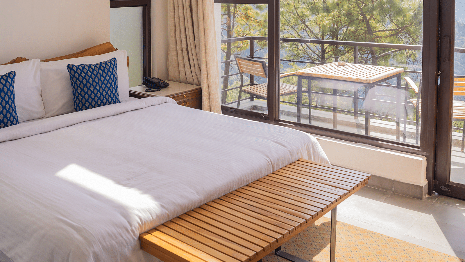 A bedroom featuring balcony at BluSalzz Escapade Resort, Lansdowne