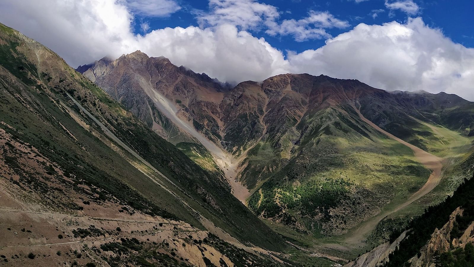  An image of valleys, mountains, and an open sky | Faraway Cottages, Auli