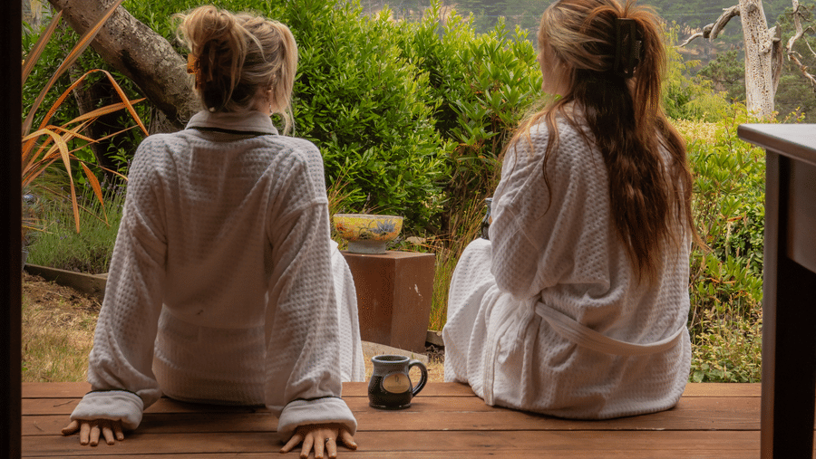 32-brewery-gulch-inn-robed-guests-relaxing-on-deck-misty-forest