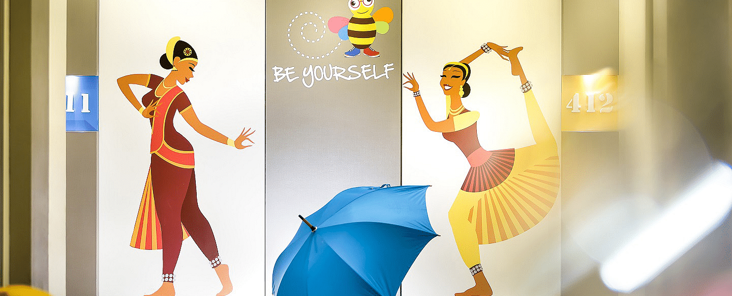 Two women performing Bharatanatyam are painted on the wall