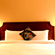 A room with a large bed, spreads, pillows, and lights. | Hotel Devnadi, Haridwar