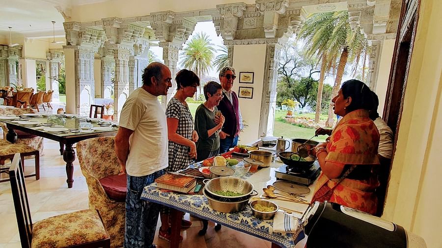 Tourists attending the cooking classes at Dev Shree, Deogarh 