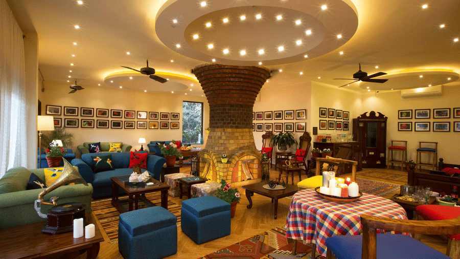 A conversation room at the resort with its plush furnishings and overhead ceiling lighting.
