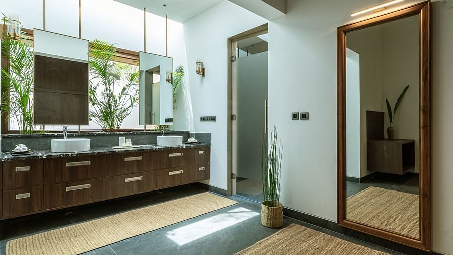 Bathroom with double sinks, mirrors, and a full-length mirror, modern design, tiled floor - Shreyas Retreat