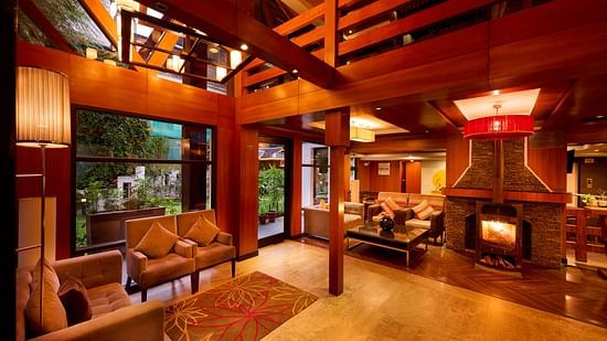 Renest Hotel Manali - Interior view of the waiting area featuring wooden decor