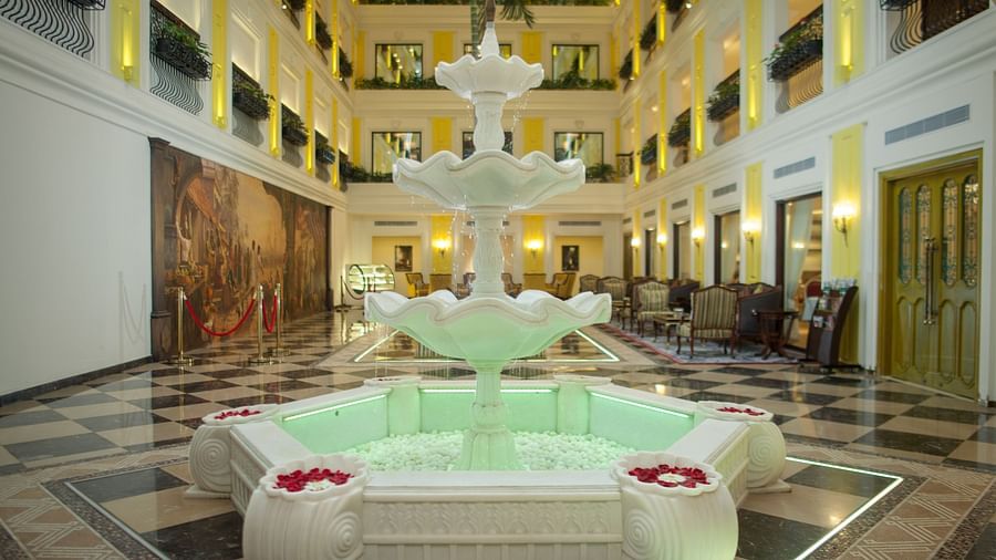 Water fountain in the lobby area illuminated by decorative lights