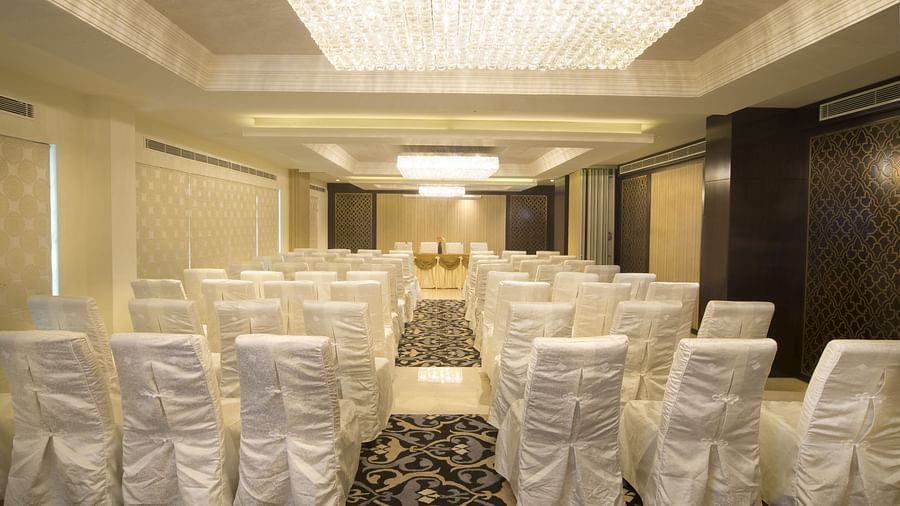 Banquet hall at Fragrant Nature Cochin, elegantly decorated with chairs and celebratory adornments