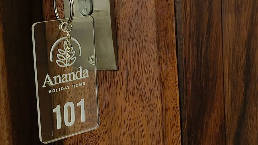 A key with a key chain of room 101 at Ananda Holiday Home, Wayanad 8