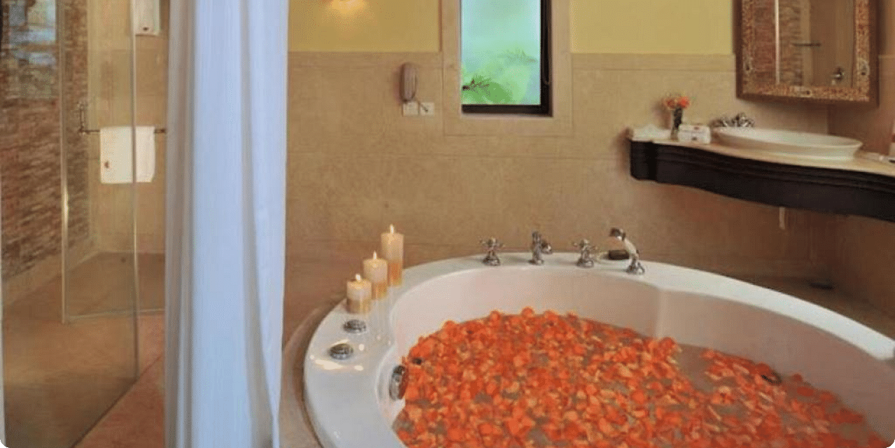 Image of a jacuzzi filled with flower petals at Rajasthali Resort & Spa Jaipur.