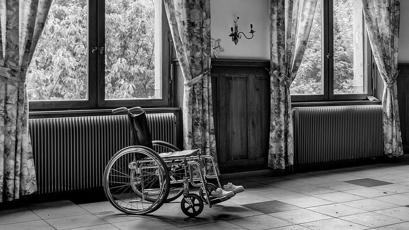 grayscale-photo-of-wheelchair-927690