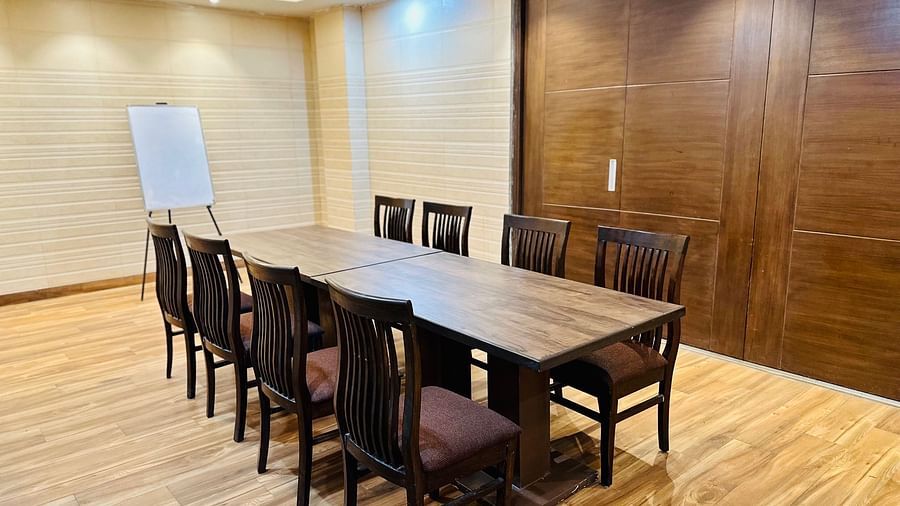Aval International - interior view of the banqet hall featuring office chairs and a witeboard