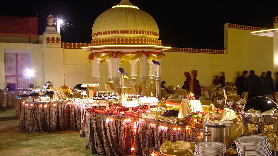 Gala Dinner at Sajjan Bagh with lights and tables  - Hotel Castle Mandawa, Jhunjunu