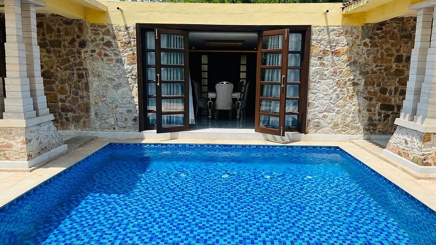 a swimming pool right in front of a room