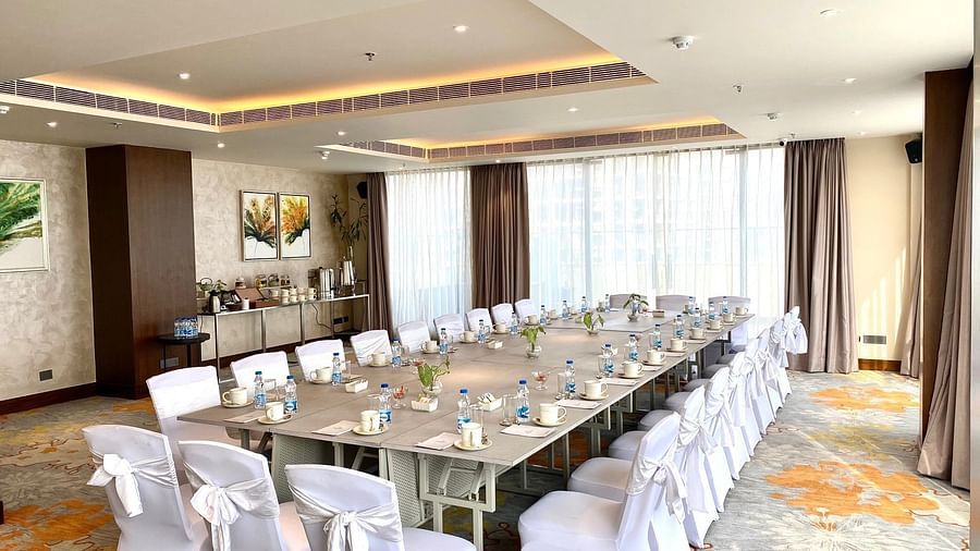 An image of the boardroom with its seating arrangement and minimal decoration - Hideaway banquets & Lawns, Greater Noida