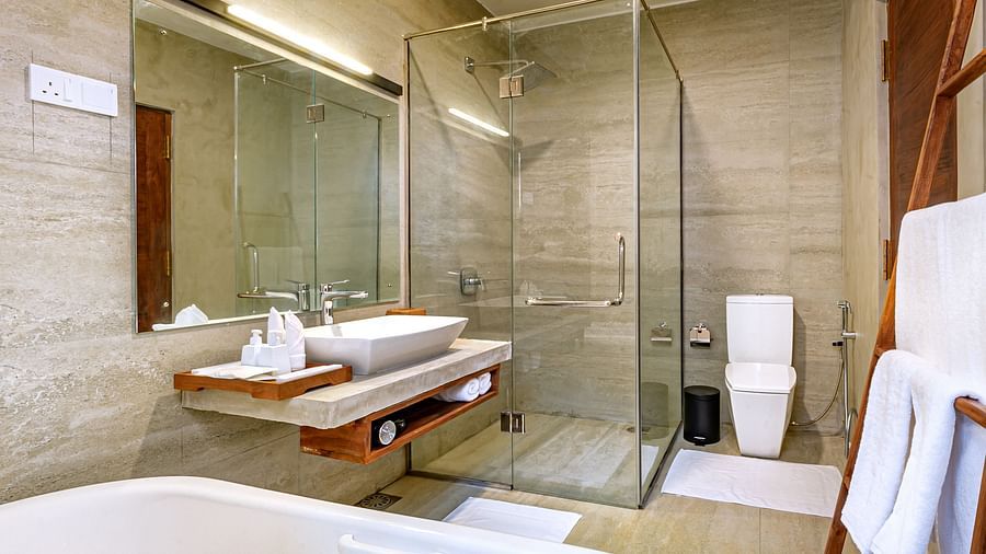 Bathroom with bathtub and glass shower enclosure