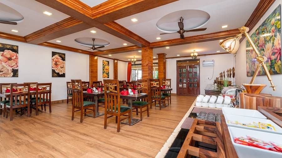 Dining arrangement in the restaurant at Summit Barsana Resort & Spa, Kalimpong
