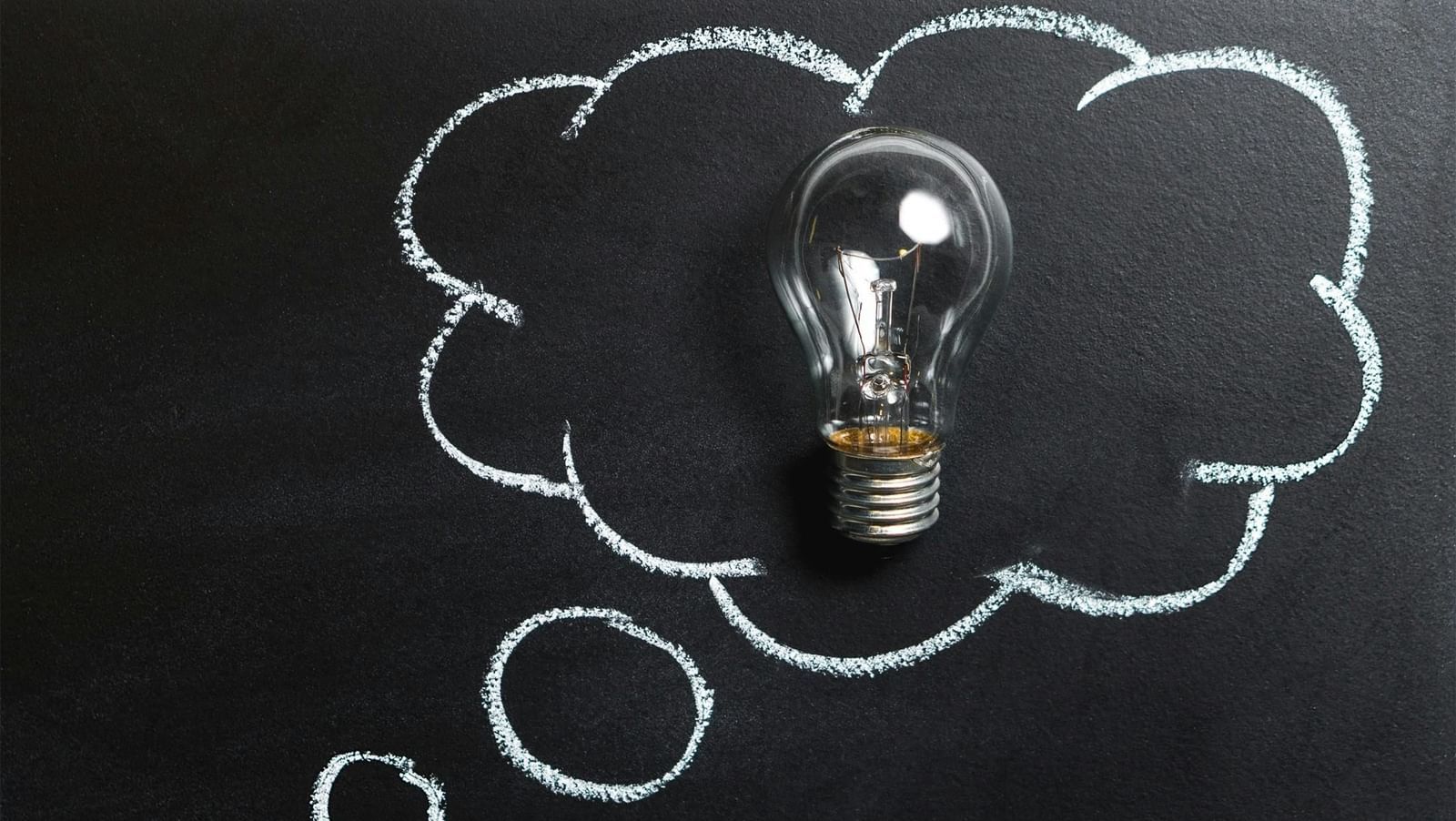 A thought cloud with a bulb in it, representing an idea