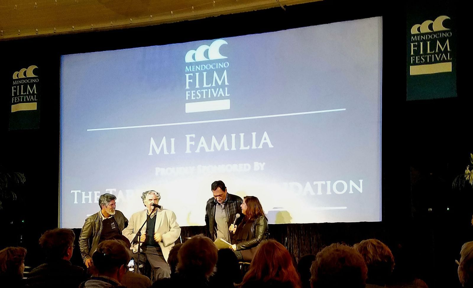 A lively scene from a film festival event, with performers on stage and an engaged audience - Brewery Gulch Inn & Spa