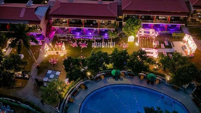 alt-text Aerial view of a wedding ceremony with floral arrangements.