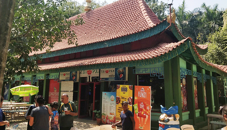 Taipan stall at Water Kingdom where people are gathered near it