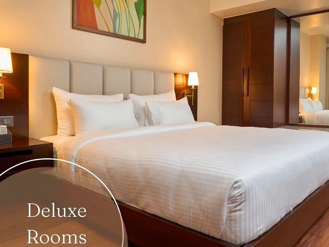 Image of a double bed at Deluxe King room at Visthara - Urban Boutique Hotel, Bangalore