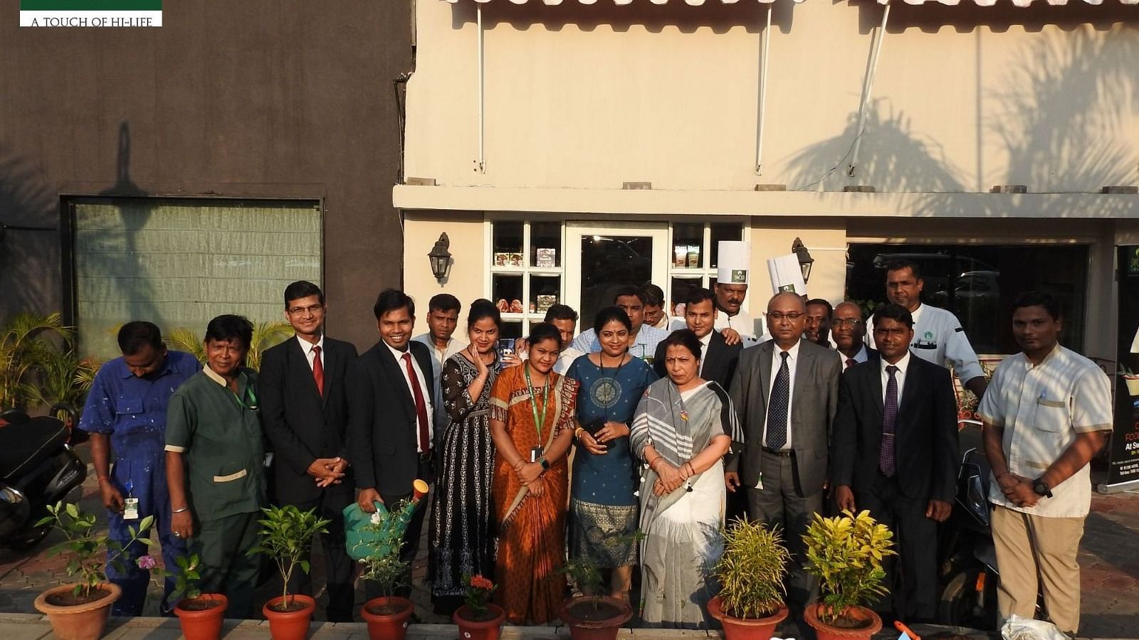 People gathered for a plantation drive at Swosti Resorts