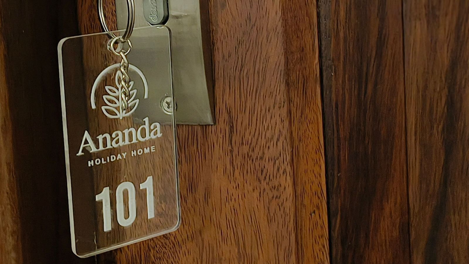 A key with a key chain of room 101 at Ananda Holiday Home, Wayanad 8