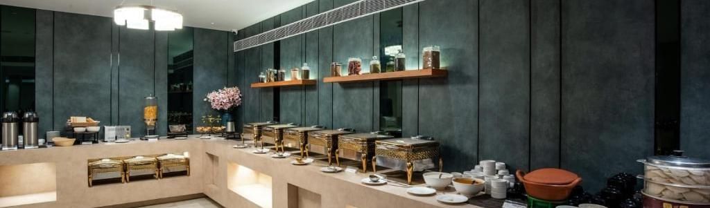 Buffet dining area with modern counters at Royal Group of Hotels