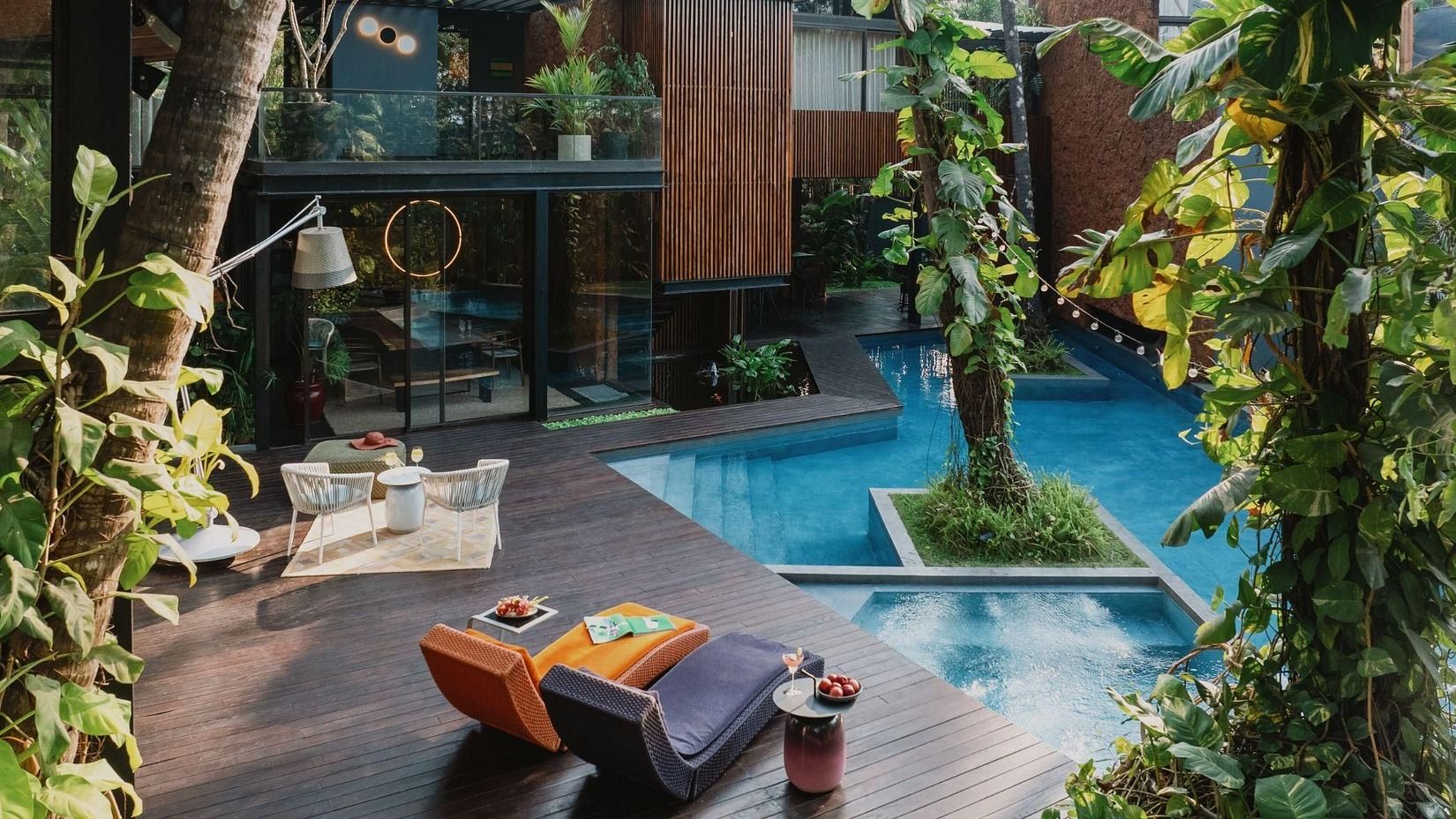 Image featuring a pool and a few plants and trees around