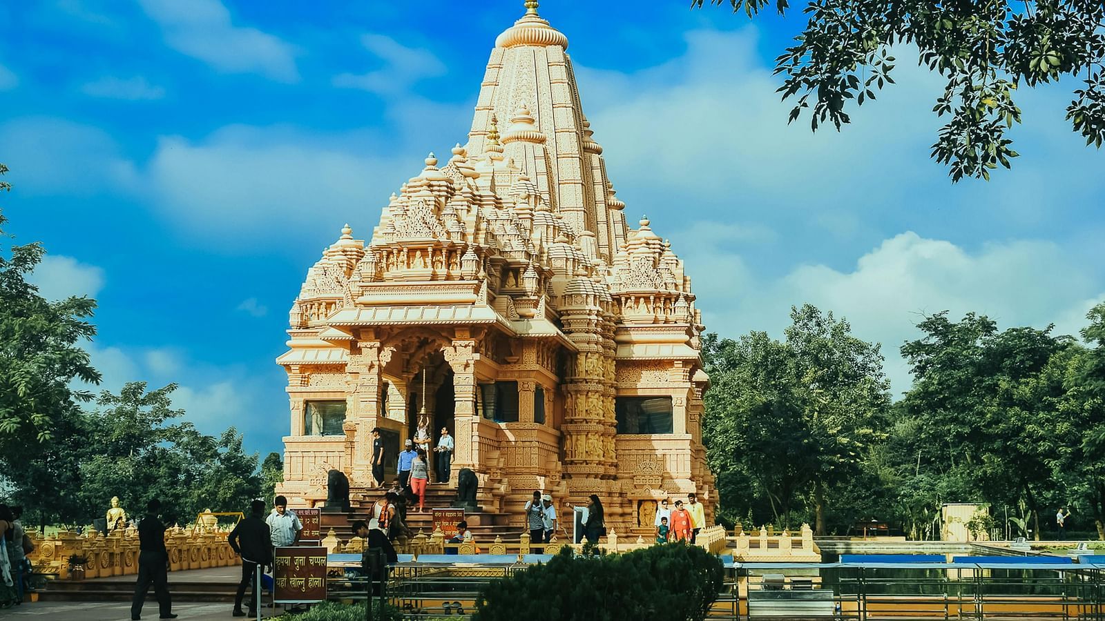 An overview of a temple with people walking inside it 