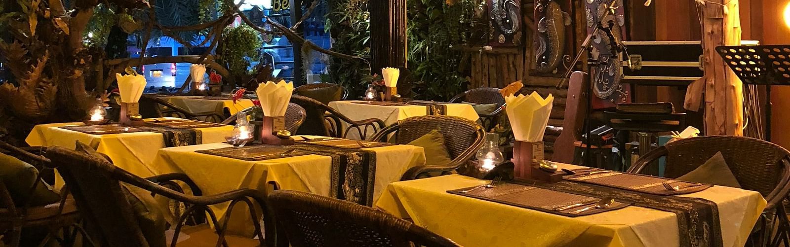 A restaurant showcasing the seating arrangement with lighting and decor
