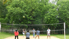 Image of Badminton Court at Fantasy Golf Resort, Bangalore showing a bunch of people playing badminton split into two groups