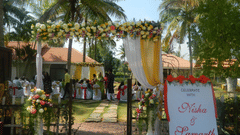 Image of the entrance to a wedding during daytime with floral decoration