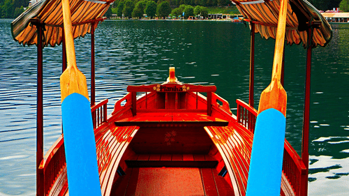 A view from inside a boat with a canopy and a waterbody in view.
