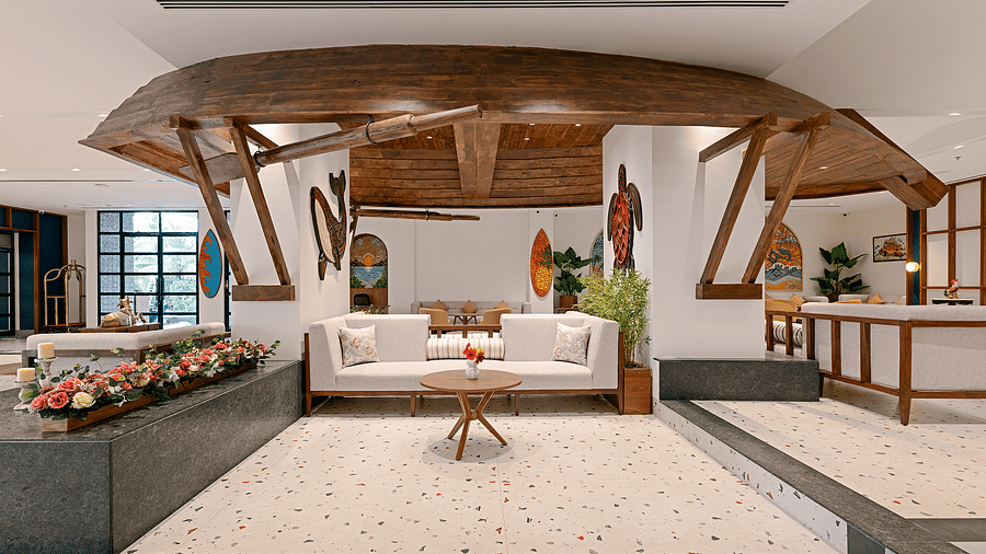 Sofas and artwork in the lobby of Cloud9 Sarovar Premiere, Palolem Goa, create a welcoming atmosphere with stylish seating and decorative pieces