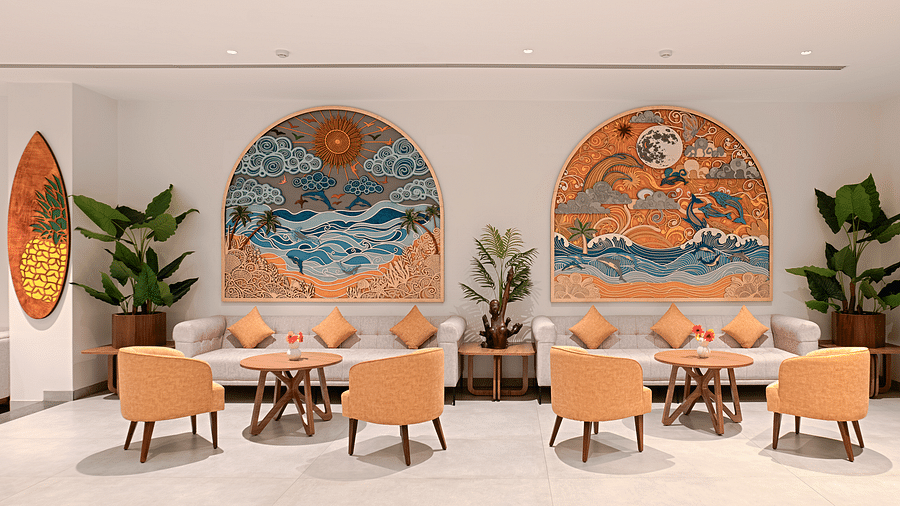Sofas and artwork in the lobby of Cloud9 Sarovar Premiere, Palolem Goa, offer a blend of comfort and style, enhancing the space with artistic touches