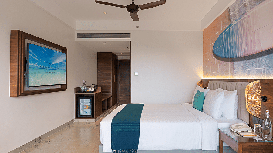 A double bed and amenities in one of the rooms at Cloud9 Sarovar Premiere, Palolem Goa, offer comfort and convenience for a relaxing stay