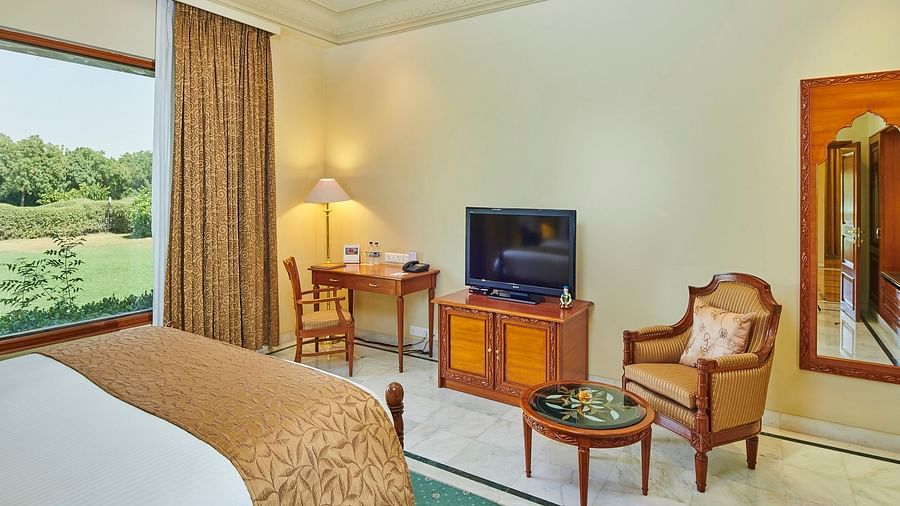 a closer view of luxe bedroom with comfy bed and amenities like a television - The Ummed Jodhpur, Palace Resort and Spa