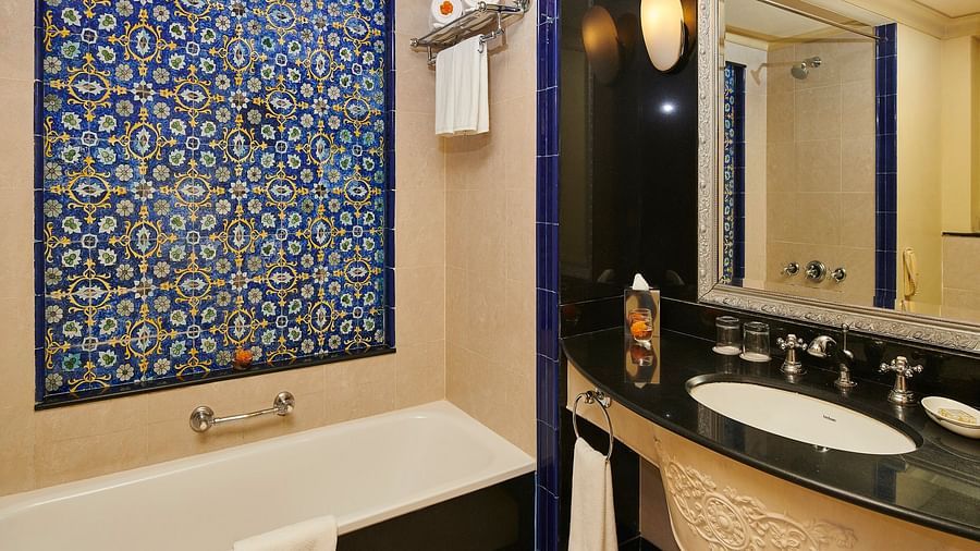 deluxe bathroom with a tub and blue walls - The Ummed Jodhpur, Palace Resort and Spa