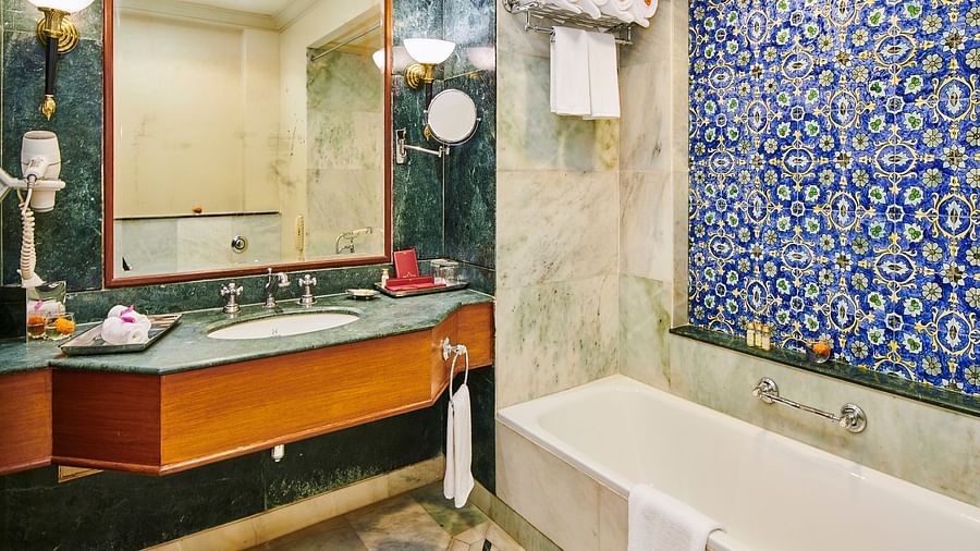 Luxury Suite bathroom with a grand mirror and bath amenities - The Ummed Jodhpur, Palace Resort and Spa
