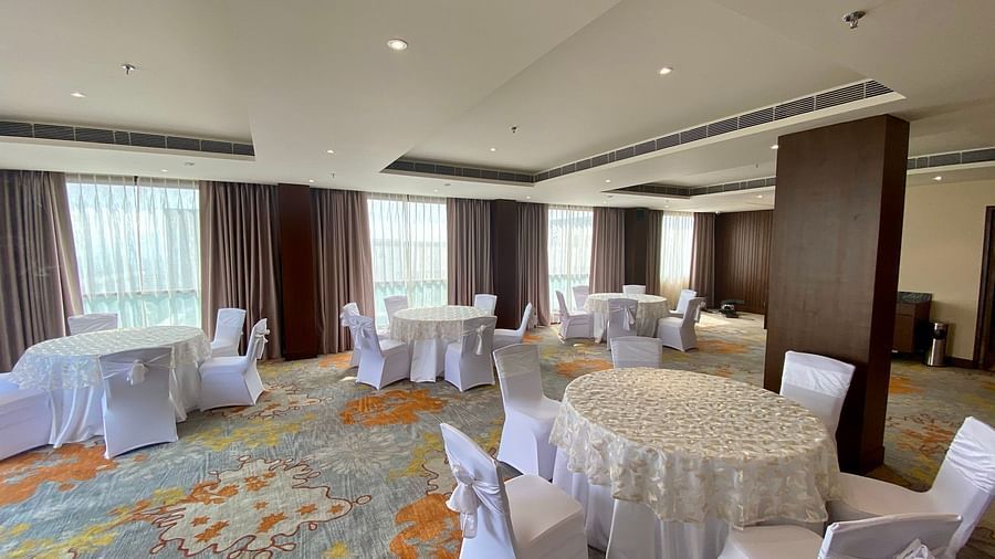 An image of a Banquet Hall with its seating arrangement - Hideaway banquets & Lawns, Greater Noida