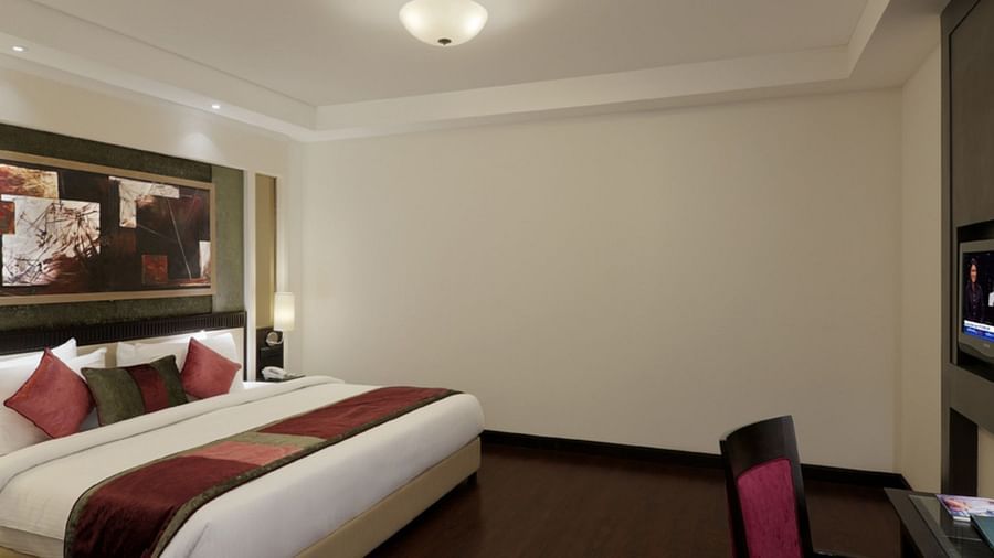 view of large size bed in Suite room of Inde Hotel Vista Woods, Gurgaon 